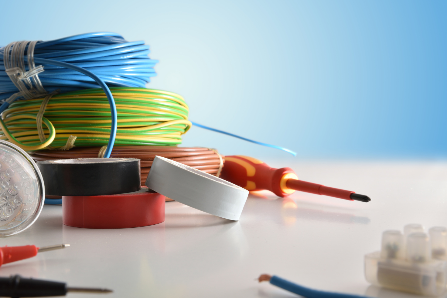 Exhibition of electrical material on wood table close up